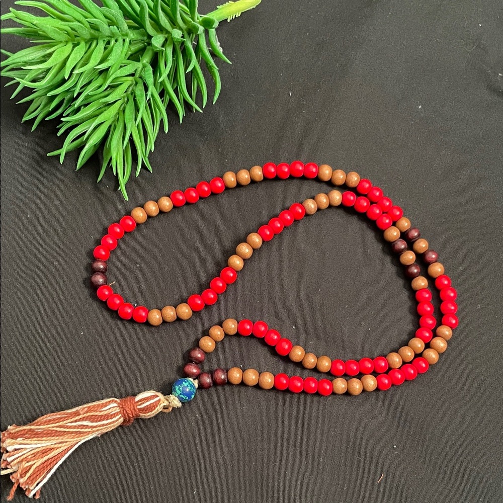 Hand assembled beaded necklace multicoloured brown tassel